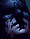 Tommy Castillo: Batman in the Rain Near Joker Graffiti